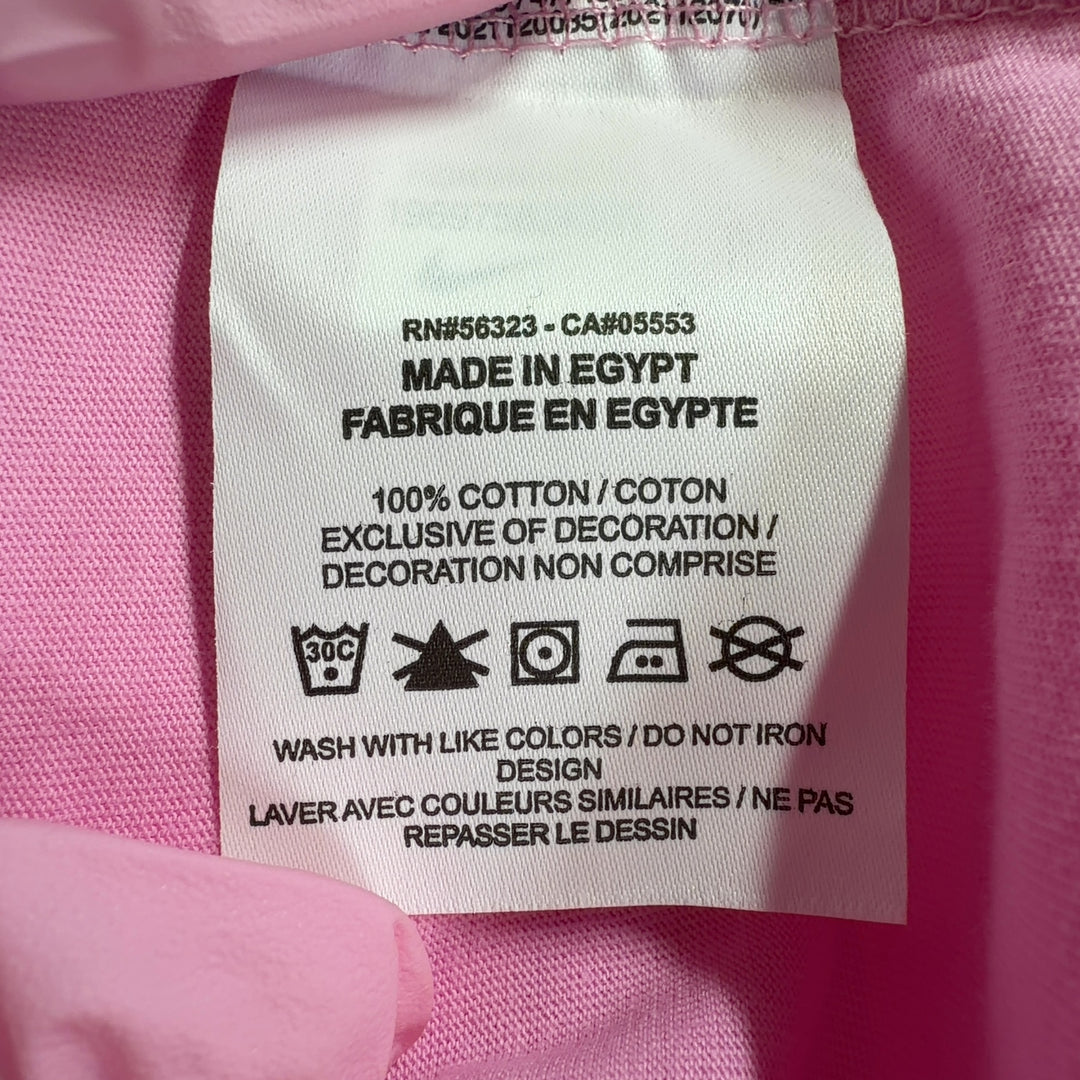 Pink cotton Nike oversized t-shirt back view, showing relaxed fit and length