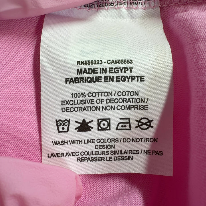 Pink cotton Nike oversized t-shirt back view, showing relaxed fit and length