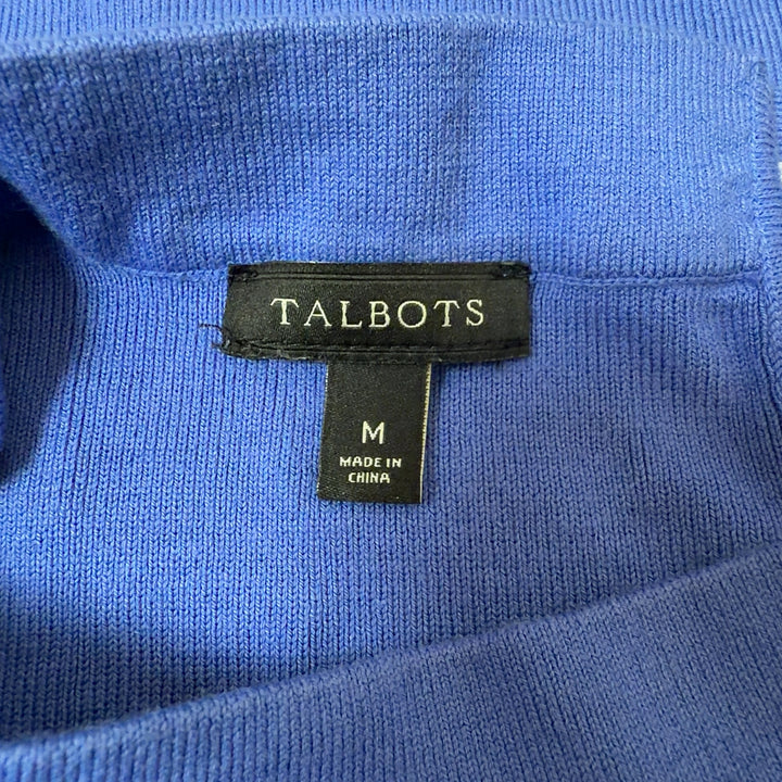 Blue crew neck top with three-quarter sleeves, back view on model