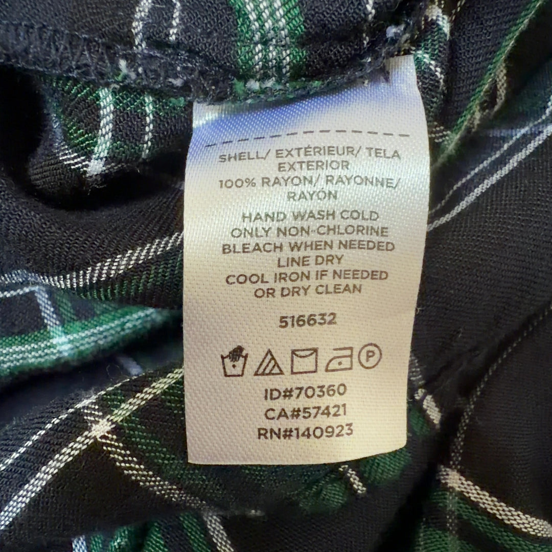 Tag view of green and black plaid rayon long sleeve top showing full plaid pattern and relaxed fit