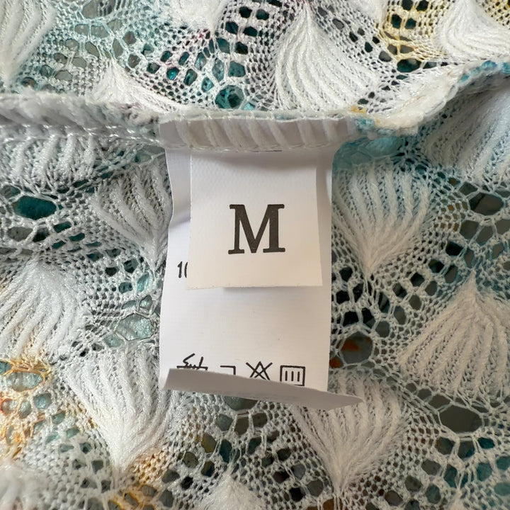 Tag view of multicolor sequin chevron maxi dress showing flowing skirt and geometric sequin pattern