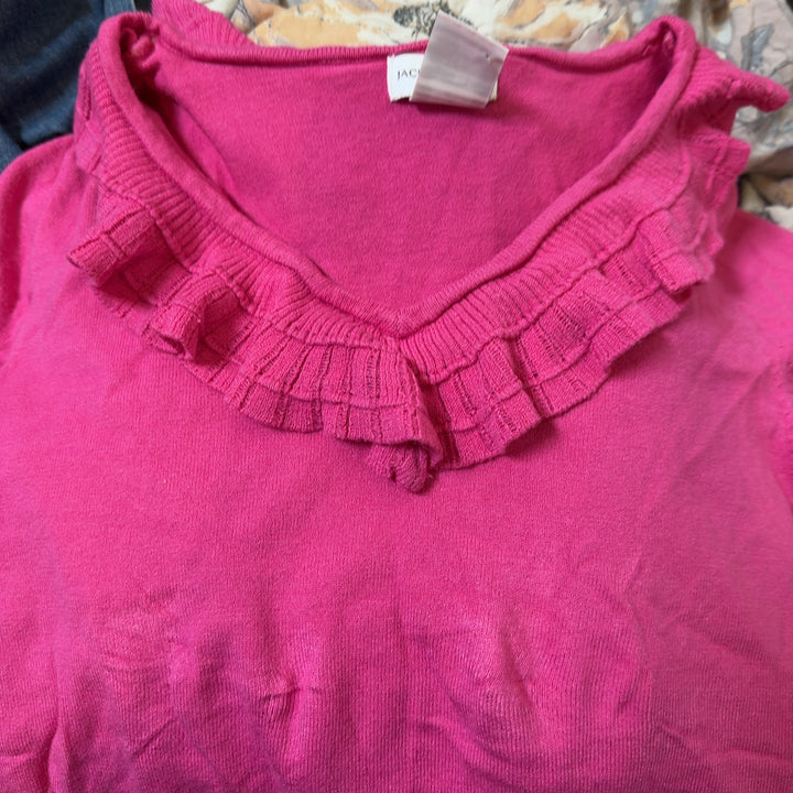 Pink ruffle V-neck short sleeve top, back view showing ruffled neckline