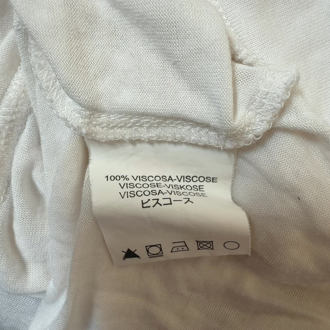 Tag view of cream M Missoni viscose top showing relaxed fit and tassel detail placement
