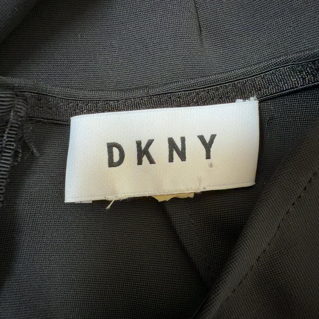 DKNY black cold shoulder wrap dress with long sleeves and wrap detail, back view
