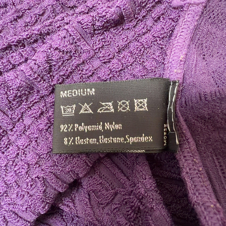 Purple ribbed zip-up top with V-neckline and three-quarter sleeves, back view