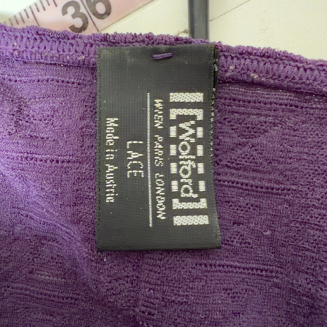 Purple ribbed zip-up top with V-neckline and three-quarter sleeves, back view