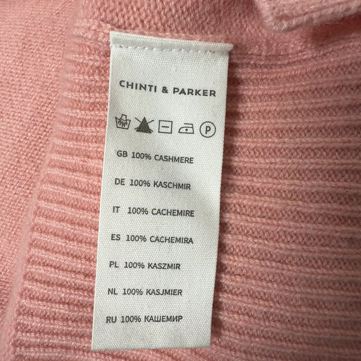 Pink cashmere crew neck pullover sweater by Chinti & Parker, back view on model