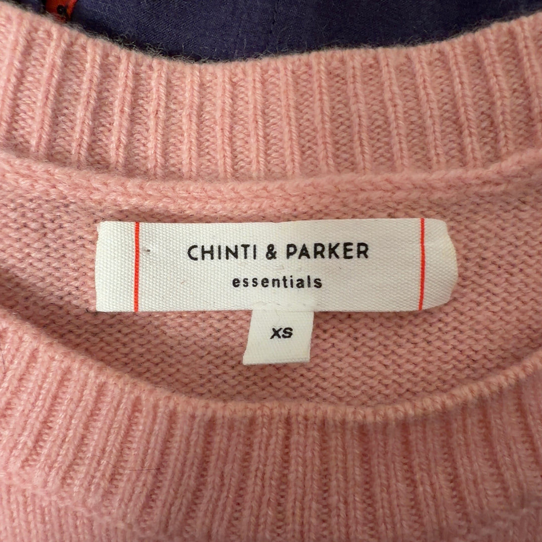 Pink cashmere crew neck pullover sweater by Chinti & Parker, back view on model