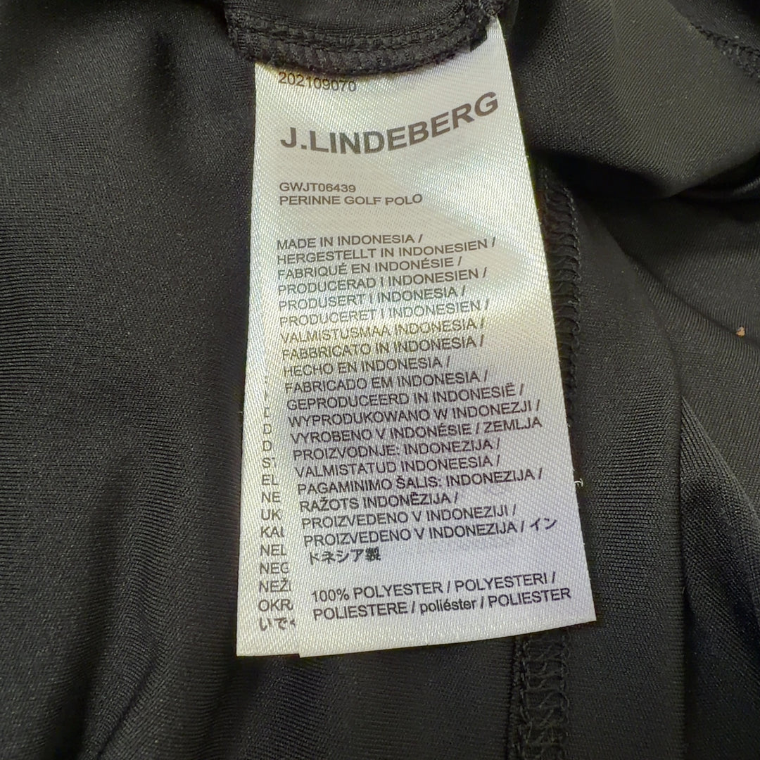 J. Lindeberg black and gold colorblock polo shirt back view, showing raglan sleeve design and tailored fit