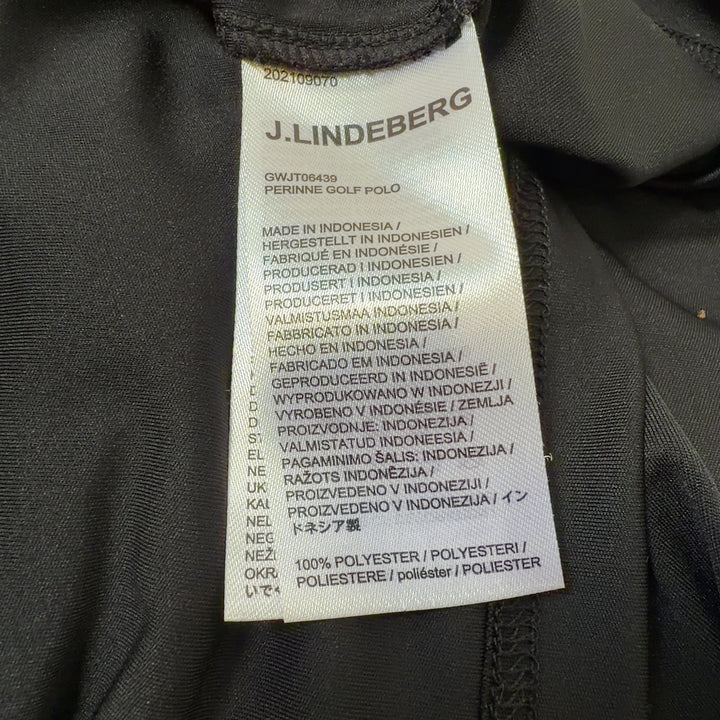 J. Lindeberg black and gold colorblock polo shirt back view, showing raglan sleeve design and tailored fit