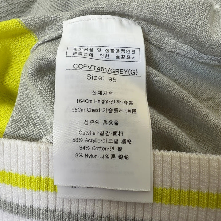 Yellow and cream color-block sleeveless vest with white full-length zipper and ribbed trim, back view