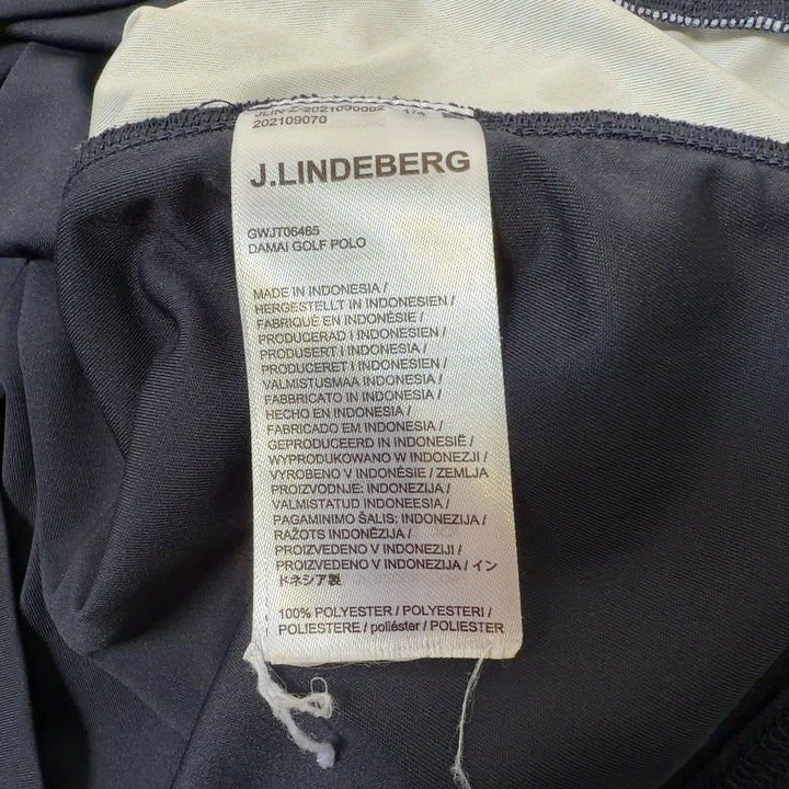 Black polo shirt with white collar and side piping detail, back view