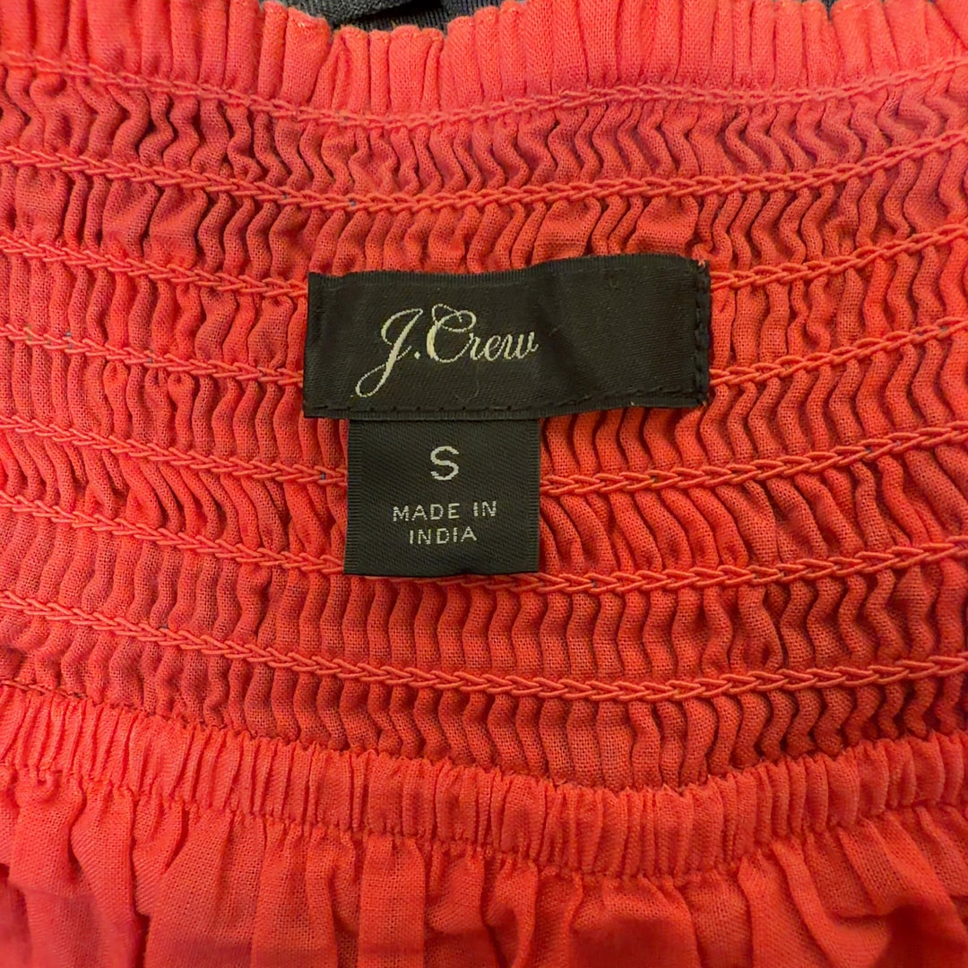 Tag view of multicolor plaid cotton midi dress showing gathered bodice and tiered ruffle detail