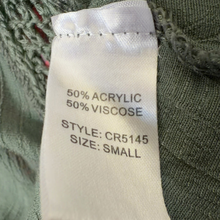 Tag view of sage green mesh overlay asymmetrical tank dress showing flowing handkerchief hem