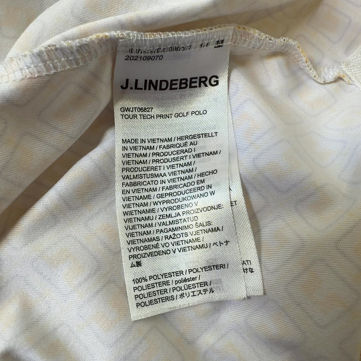 J. Lindeberg yellow geometric print polo shirt back view, showing full design and fit on model