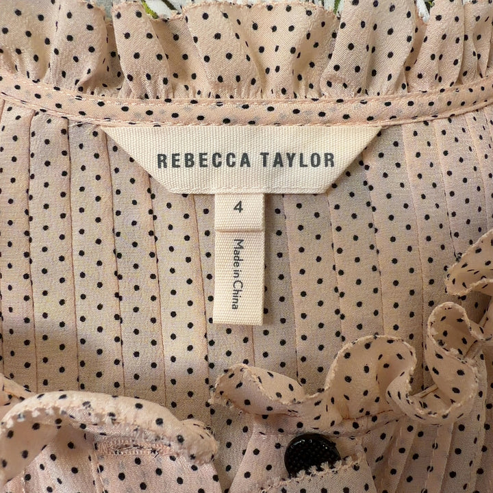 Tag view of cream silk pleated blouse showing relaxed fit and long sleeves