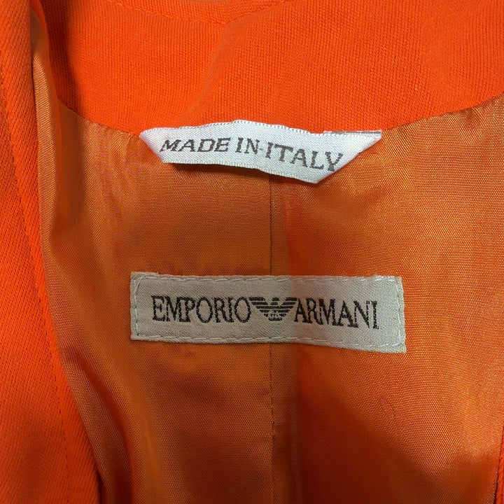 Orange cropped blazer with jeweled buttons by Emporio Armani, back view