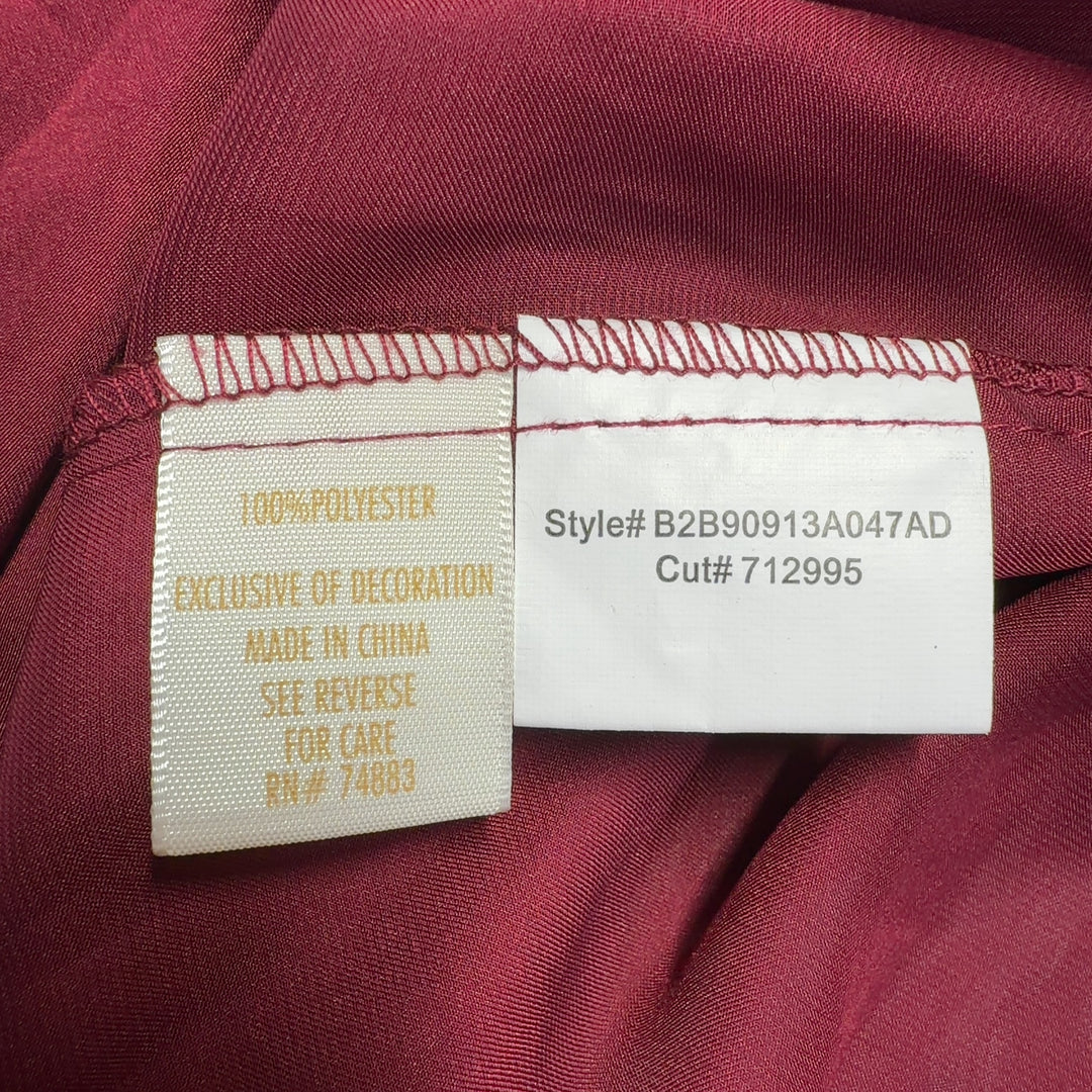 Burgundy button-up shirt with tie waist detail, back view