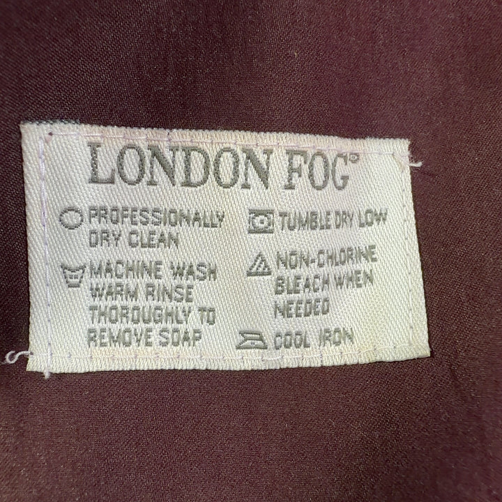 Burgundy double-breasted trench coat with adjustable belt, back view showing midi length