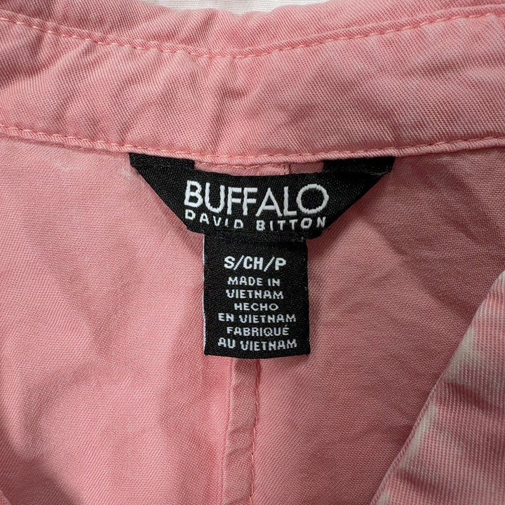 Tag view of pink short-sleeve button-up shirt showing relaxed fit and rolled sleeves