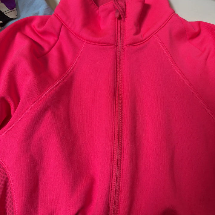 Pink half-zip athletic long sleeve top back view on model