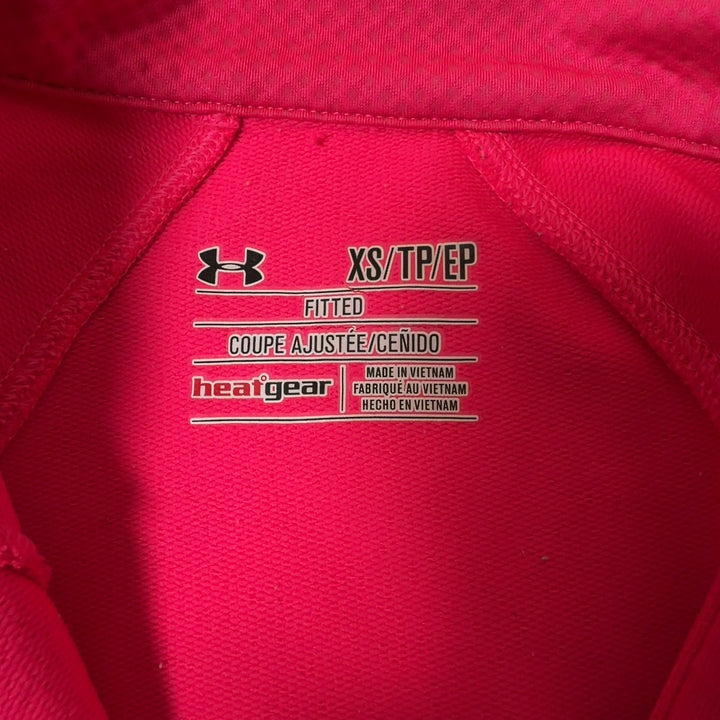 Pink half-zip athletic long sleeve top back view on model
