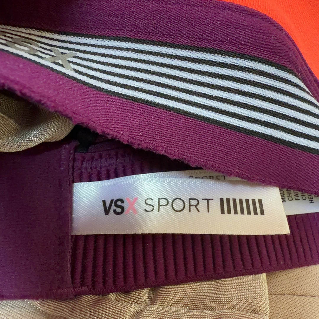 Coral VSX Sport sports bra with black trim, back view showing supportive design