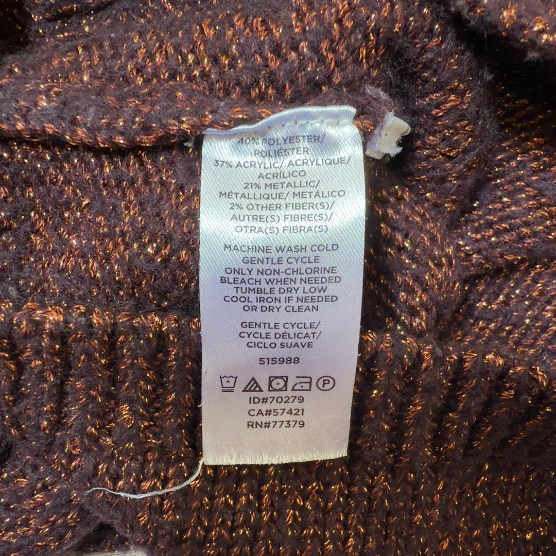 Tag view of burgundy metallic knit pullover sweater showing cropped length and fitted silhouette