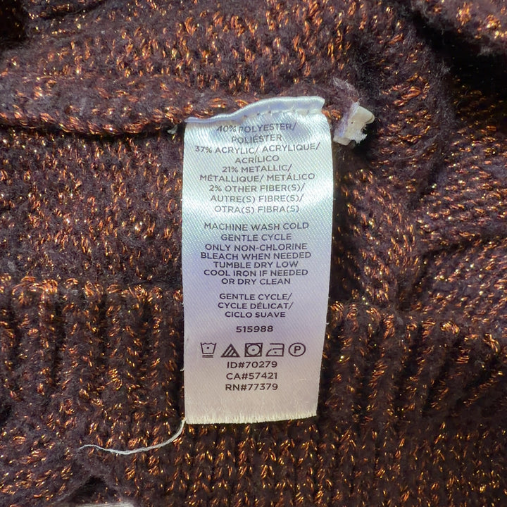 Tag view of burgundy metallic knit pullover sweater showing cropped length and fitted silhouette