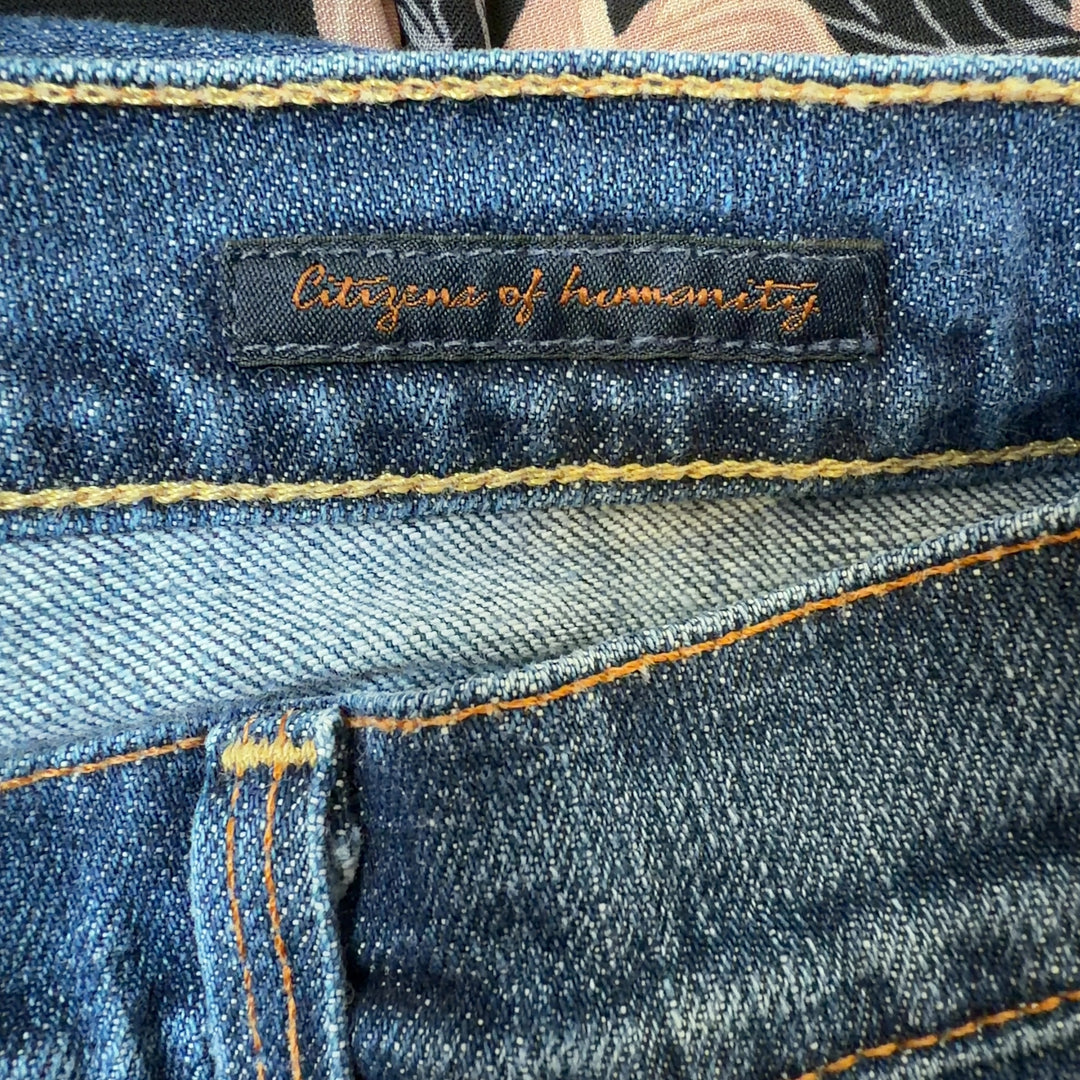 Tag view of blue denim cropped flare jeans by Citizens of Humanity showing flattering flare cut and cropped length at knee