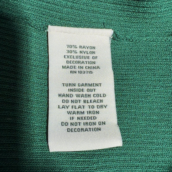 Tag view of green ribbed knit top with three-quarter sleeves and chain neckline by Nanette Lepore