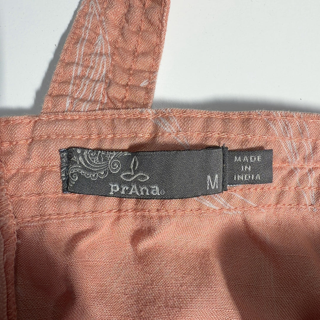Tag view of peach Tencel Lyocell midi dress showing relaxed A-line silhouette and sleeveless design