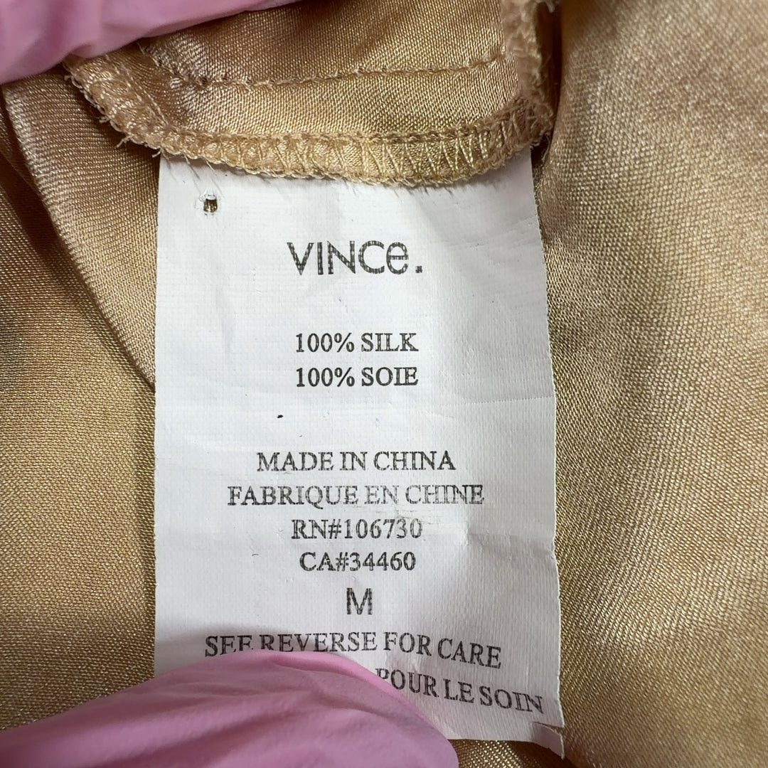 Cream silk tunic top with tie neckline, back view showing relaxed silhouette