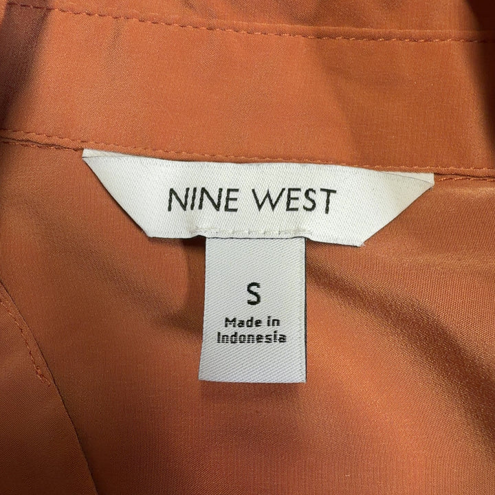 Nine West orange polyester button-up shirt back view showing full-length sleeves and button closure
