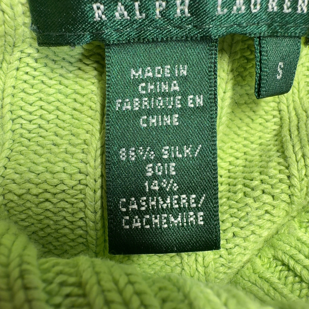 Tag view of lime green cashmere silk cropped sweater showing cable knit design and cowl neckline