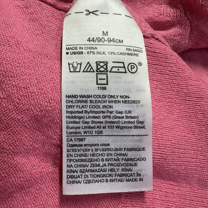 Pink cashmere silk crew neck sweater back view on model