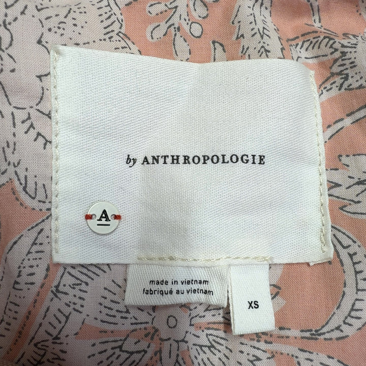 Beige camouflage utility jacket by Anthropologie, back view showing relaxed fit and structured silhouette