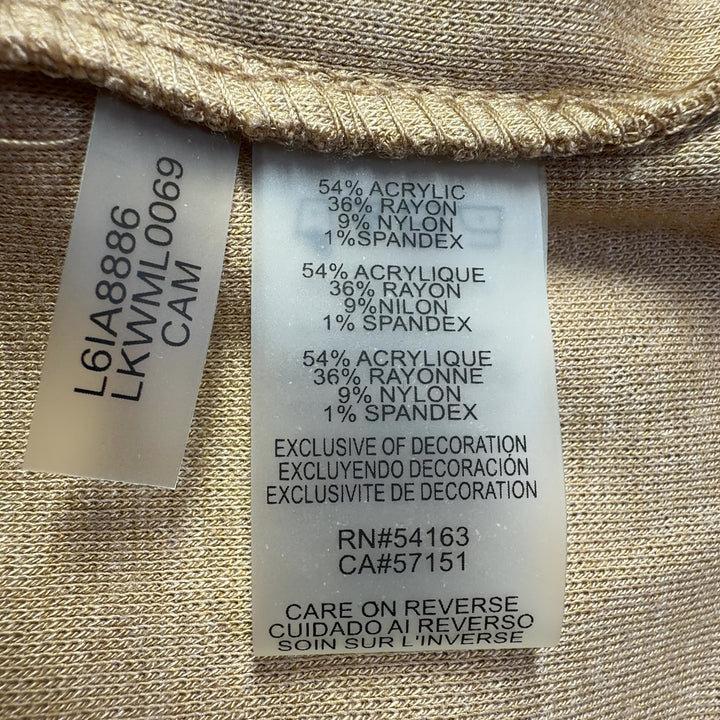 Tag view of camel studded knit sweater showing diagonal metallic stud pattern