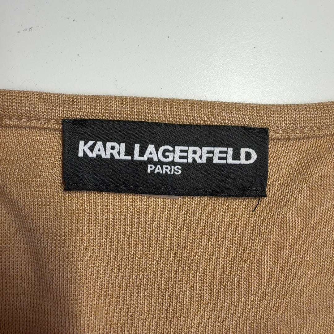 Tag view of camel studded knit sweater showing diagonal metallic stud pattern