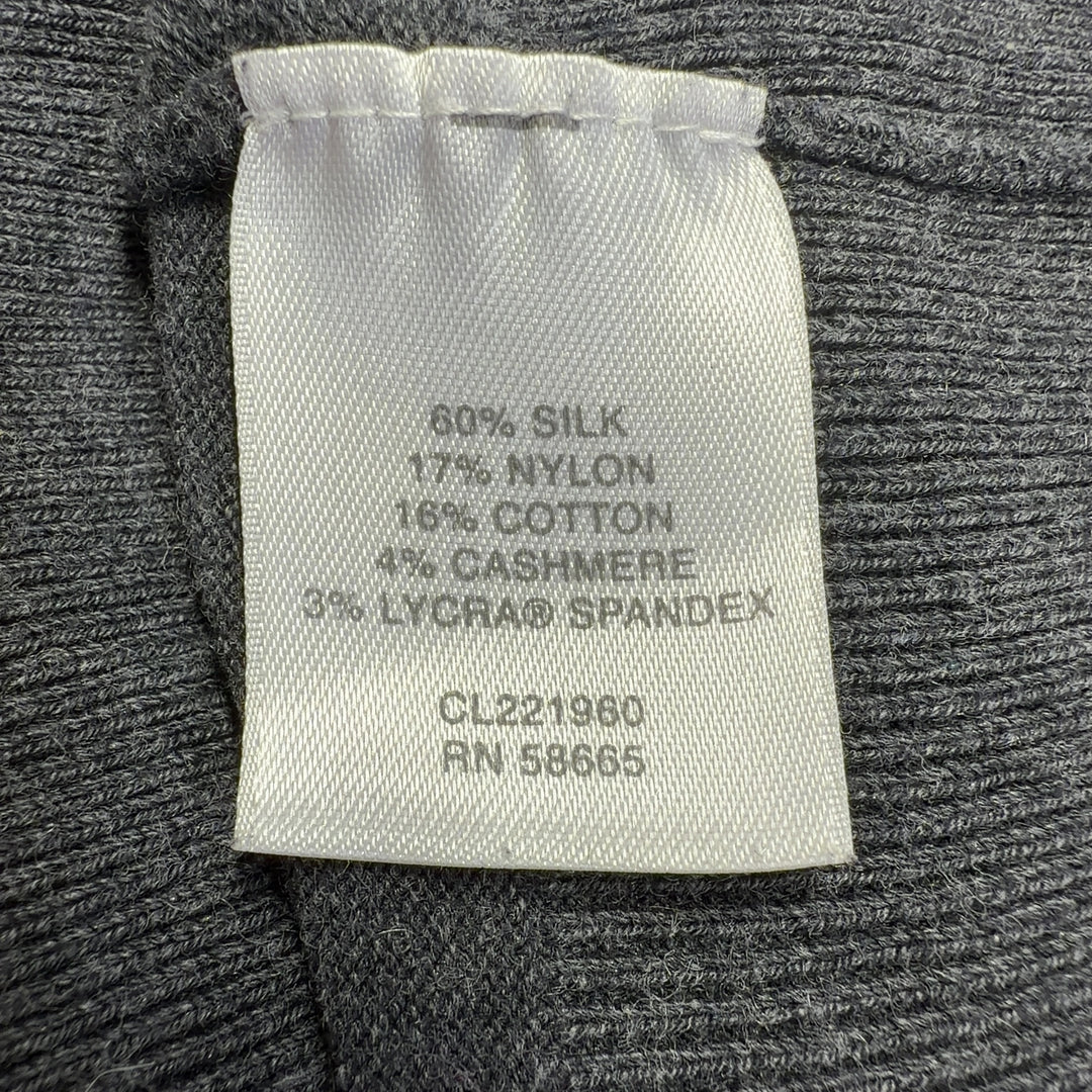 Tag view of charcoal cashmere cowl neck sweater showing fitted design and elegant draping