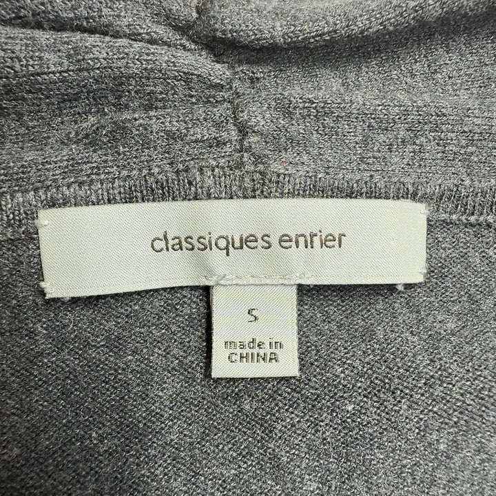 Tag view of charcoal cashmere cowl neck sweater showing fitted design and elegant draping