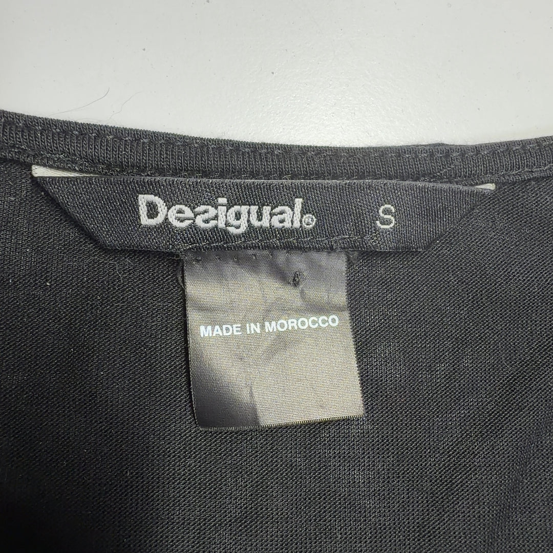 Black Desigual mixed print top back view showing artistic white pattern design and relaxed fit silhouette