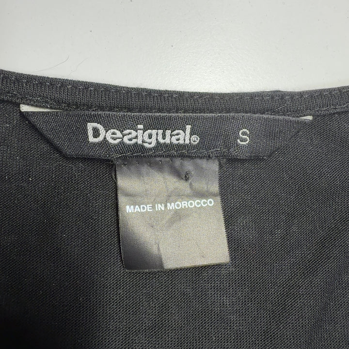 Black Desigual mixed print top back view showing artistic white pattern design and relaxed fit silhouette