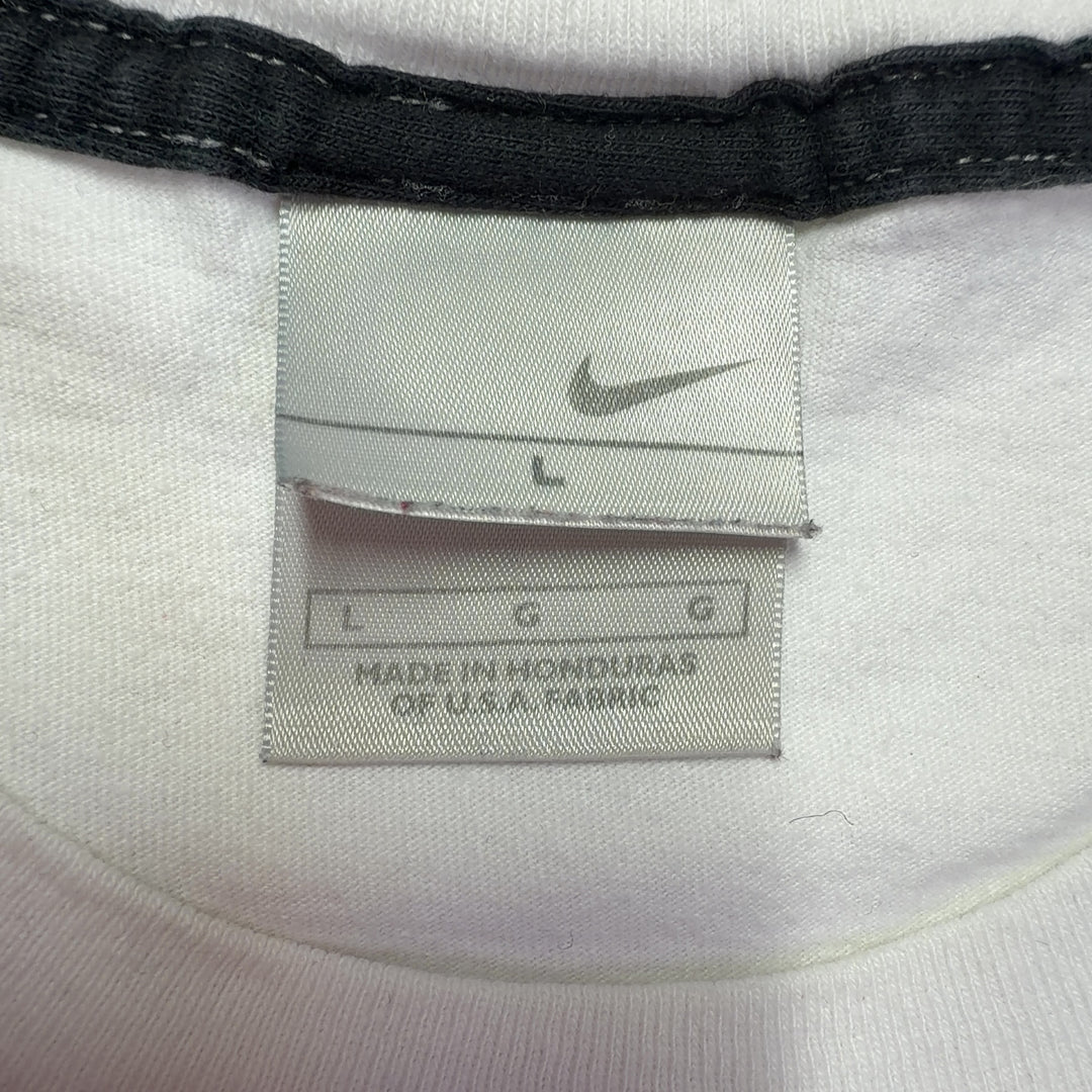 White cotton Nike t-shirt back view showing relaxed fit and Swoosh logo detail