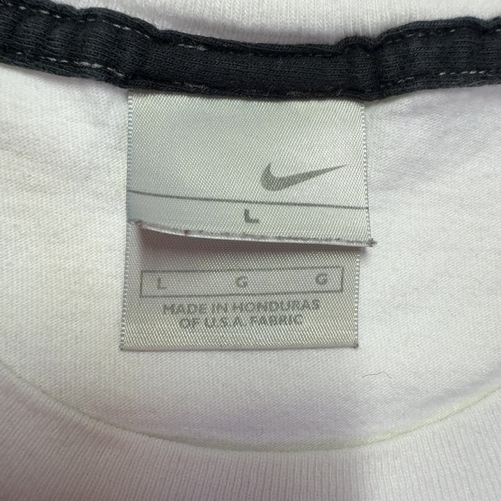 White cotton Nike t-shirt back view showing relaxed fit and Swoosh logo detail