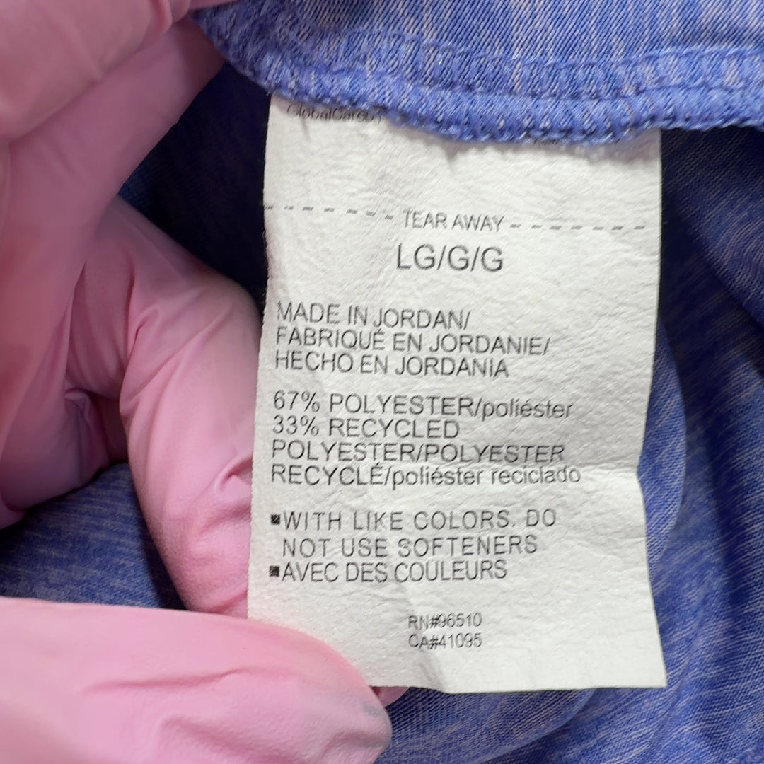 Tag view of heathered blue Under Armour activewear t-shirt showing relaxed fit and design details