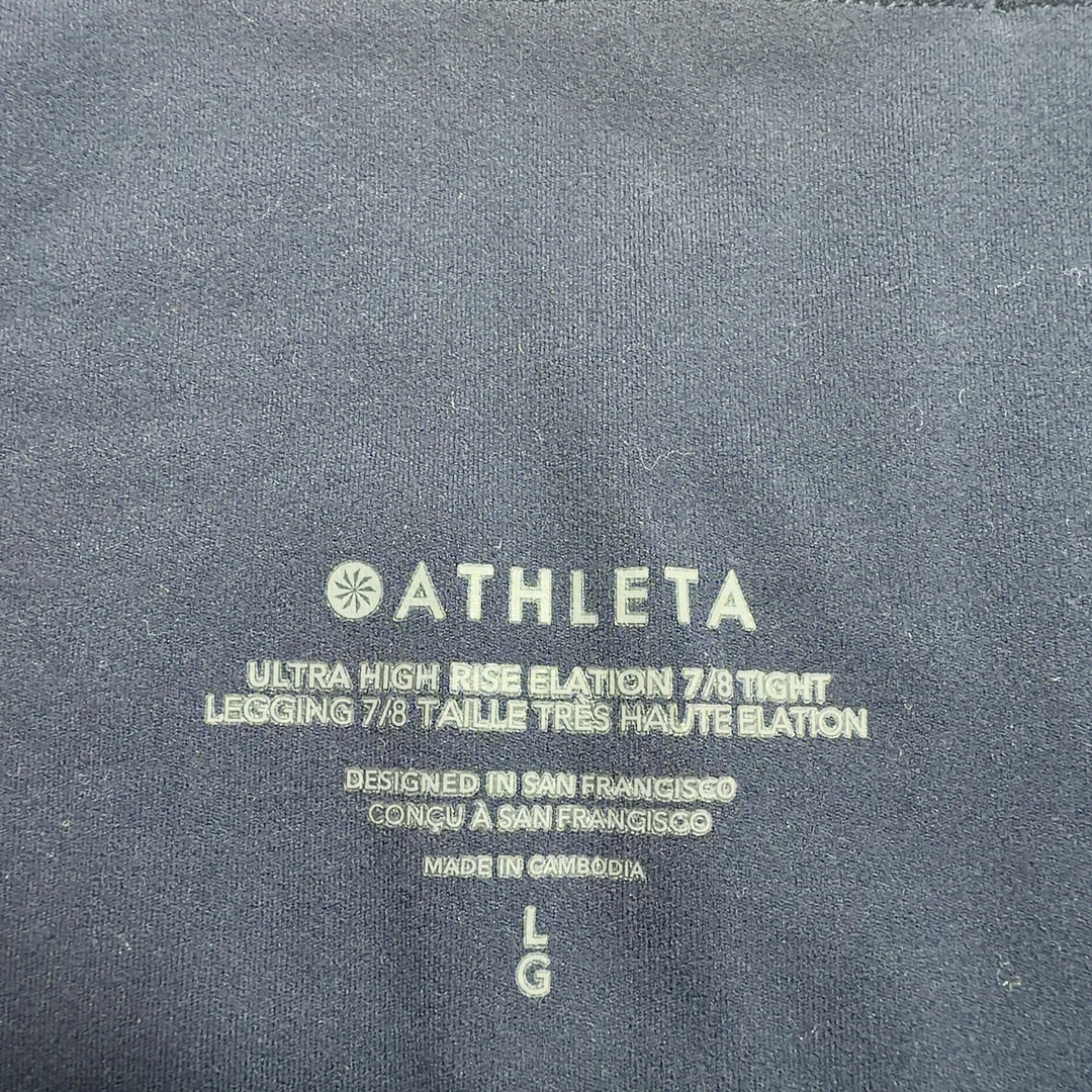 Black high-waist capri leggings back view displaying form-fitting design and cropped length