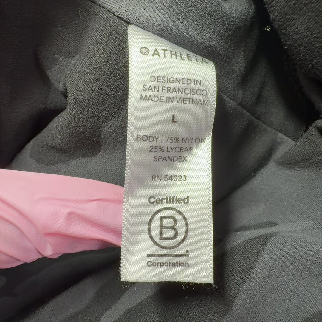 Black camo capri leggings back view showing high-waisted fit and form-fitting silhouette