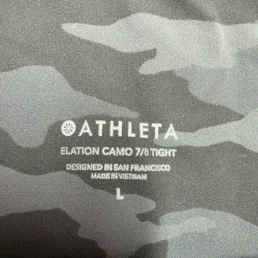Black camo capri leggings back view showing high-waisted fit and form-fitting silhouette