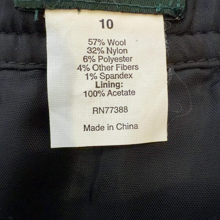 Olive green pleated A-line skirt, back view showing elegant drape and fit